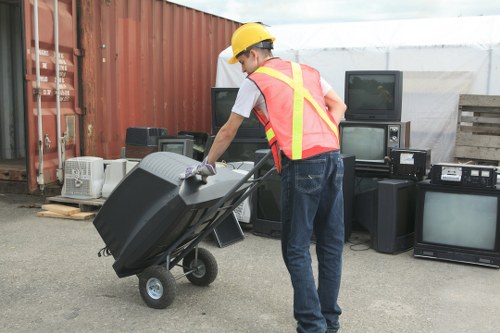 Man and van loading office clearance items in Kingston town centre